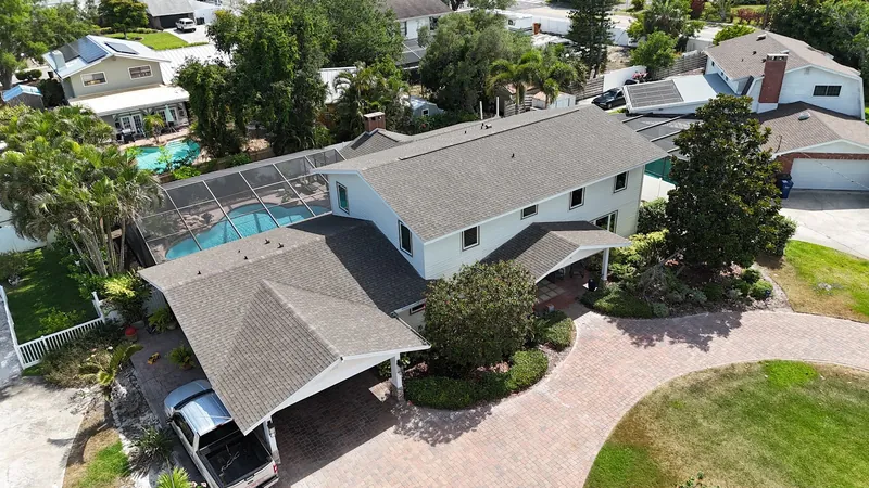 Completed architectural shingle roof on a two-story Southwest Florida home