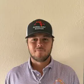 Mike Acklin, co-owner of Florida Gulf Roofing, wearing a company cap